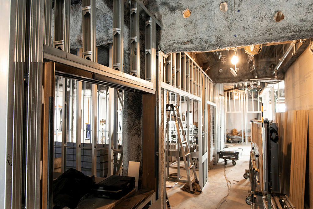 building under construction. Interior walls with no drywall, just insulation and studs